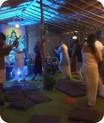 Yatri moving to music under blue light